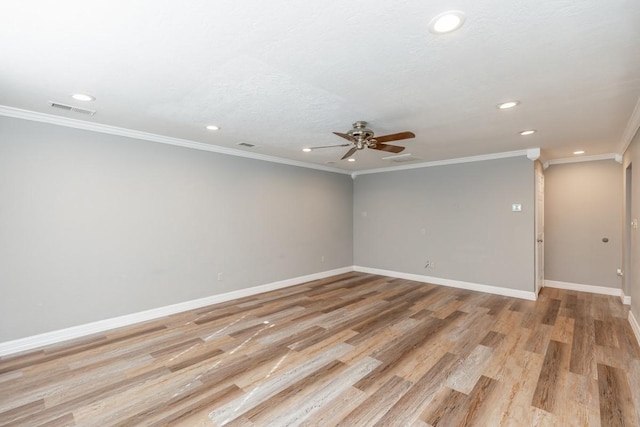 spare room with light hardwood / wood-style floors, ceiling fan, and ornamental molding