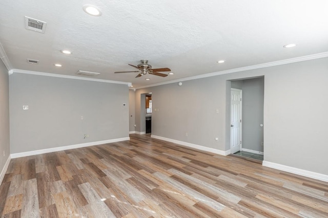 spare room with ceiling fan, light hardwood / wood-style flooring, a textured ceiling, and ornamental molding