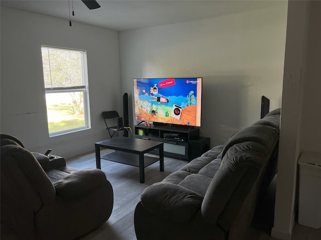 living room featuring hardwood / wood-style flooring and ceiling fan