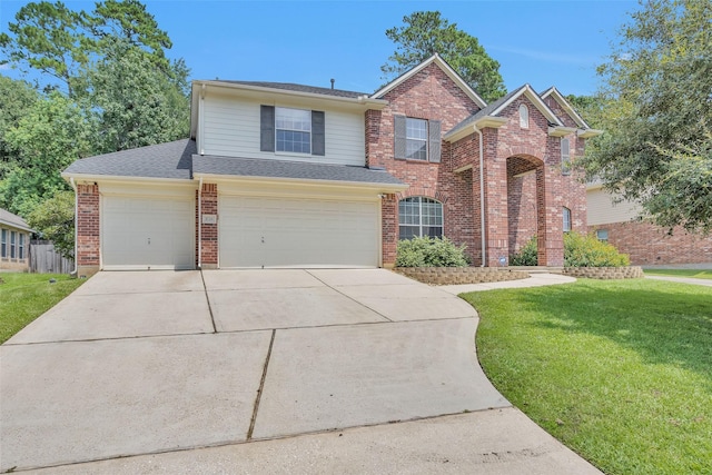 view of front facade with a garage and a front lawn