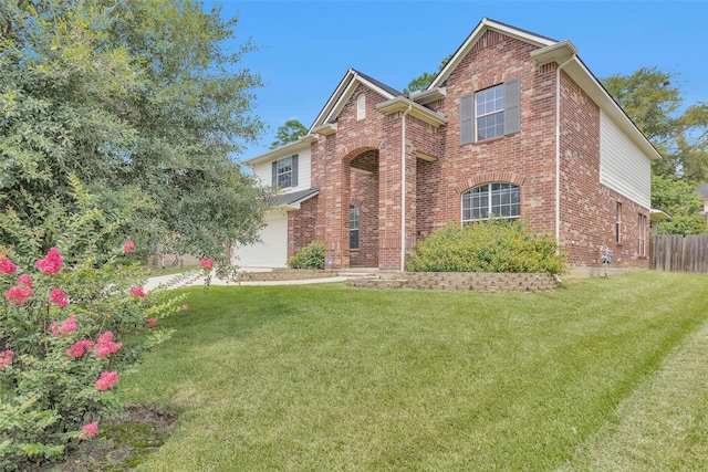 view of front of house with a garage and a front lawn