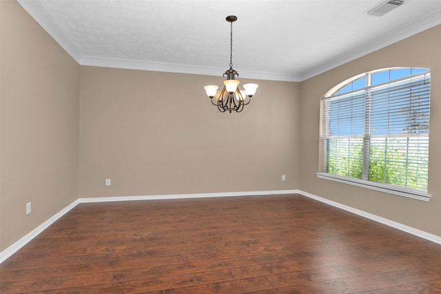 unfurnished room with a healthy amount of sunlight, ornamental molding, dark wood-type flooring, and a chandelier