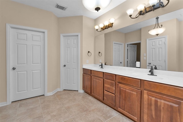 bathroom featuring tile patterned floors and vanity