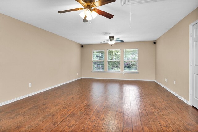 unfurnished room featuring ceiling fan and dark hardwood / wood-style floors