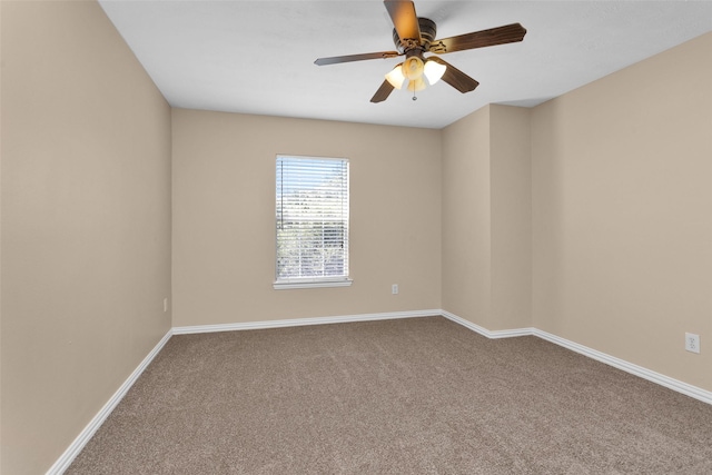 carpeted empty room featuring ceiling fan