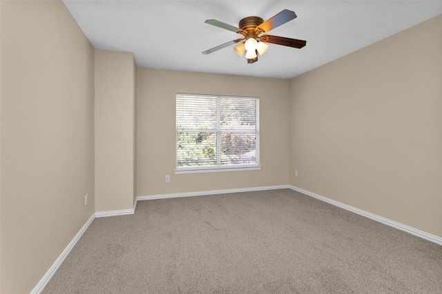 empty room featuring light carpet and ceiling fan