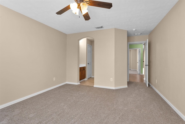 unfurnished bedroom featuring ceiling fan and light colored carpet