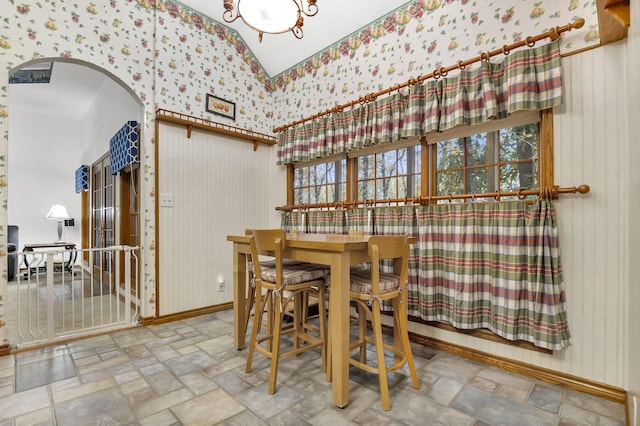 dining area featuring lofted ceiling