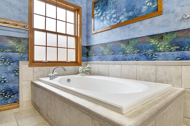 bathroom featuring tile patterned flooring and a relaxing tiled tub