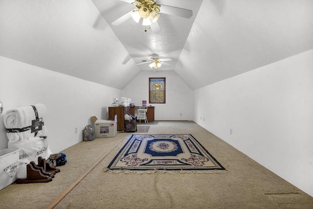 additional living space with carpet flooring, a textured ceiling, ceiling fan, and lofted ceiling