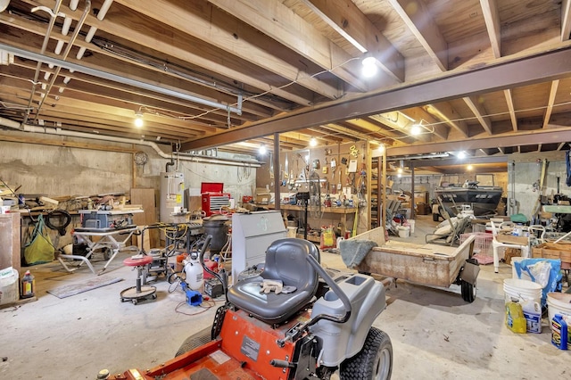 basement with a workshop area and gas water heater