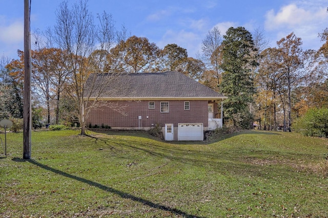 view of property exterior featuring a yard and a garage