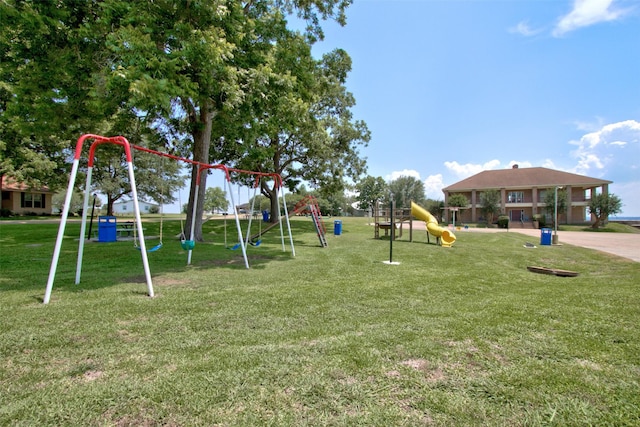 view of jungle gym featuring a lawn