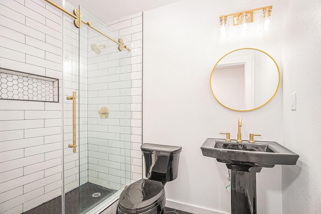 bathroom featuring a shower with shower door