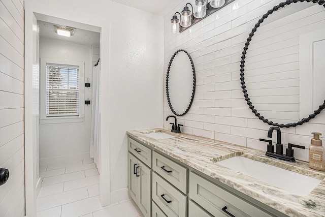 bathroom featuring tile patterned floors and vanity