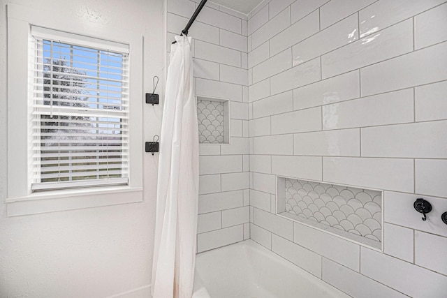 bathroom featuring shower / bath combo with shower curtain