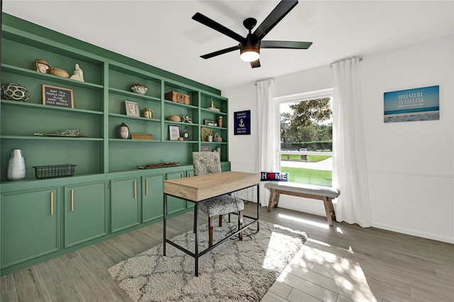 office featuring ceiling fan and light hardwood / wood-style flooring