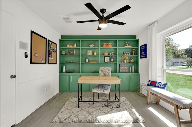 office featuring hardwood / wood-style floors and ceiling fan