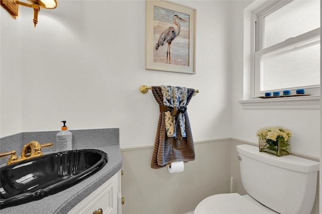 bathroom with vanity and toilet