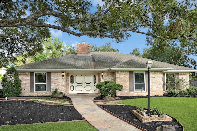 ranch-style house with a front yard