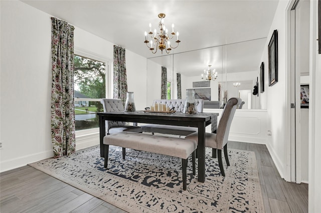 dining room with a chandelier and wood-type flooring