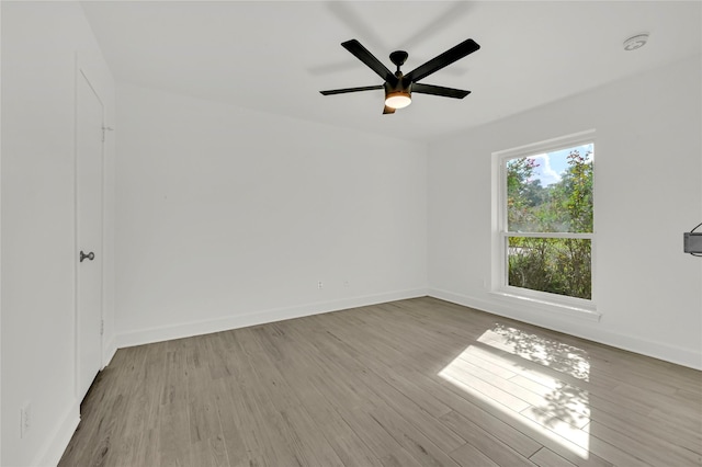 spare room featuring ceiling fan and light wood-type flooring