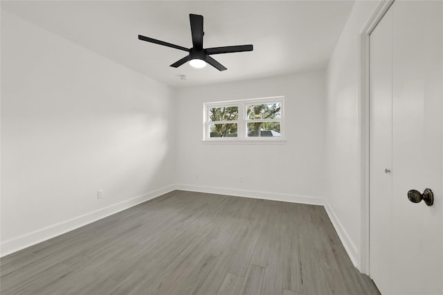 unfurnished room featuring ceiling fan and hardwood / wood-style flooring