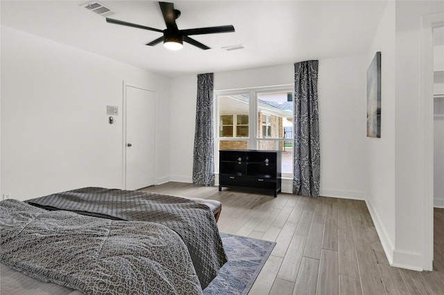 bedroom featuring light hardwood / wood-style floors and ceiling fan