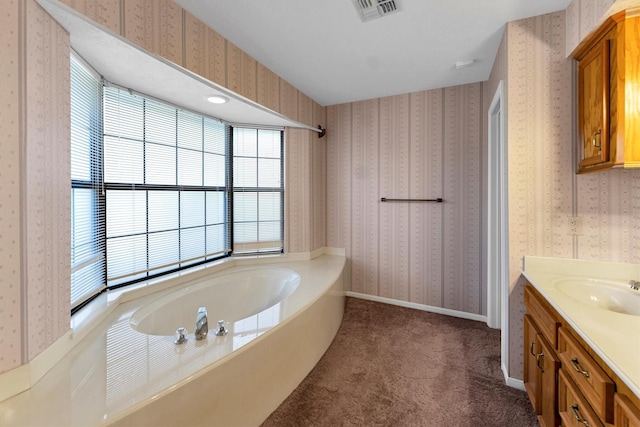 bathroom featuring vanity and a bathtub