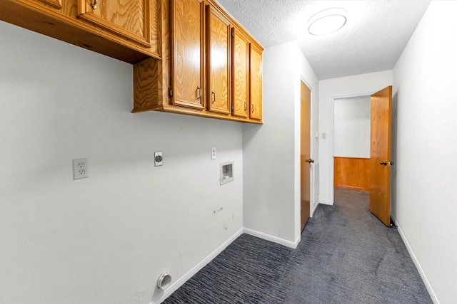 washroom with cabinets, a textured ceiling, dark carpet, hookup for a washing machine, and hookup for an electric dryer