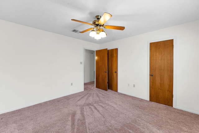 unfurnished bedroom featuring carpet floors and ceiling fan