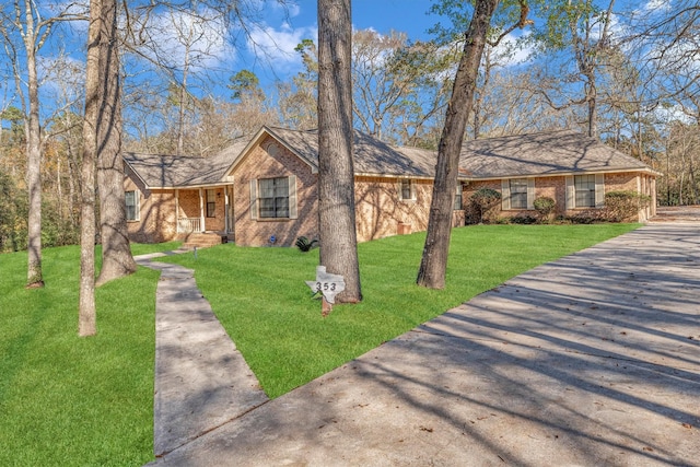 ranch-style home with a front lawn