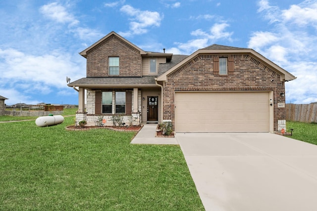 view of front of home with a front yard and a garage