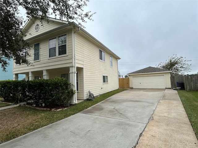 view of side of property featuring a garage and an outdoor structure