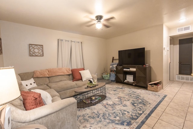 living room featuring ceiling fan and light tile patterned floors