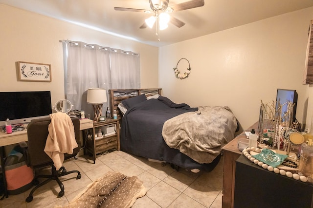 tiled bedroom featuring ceiling fan