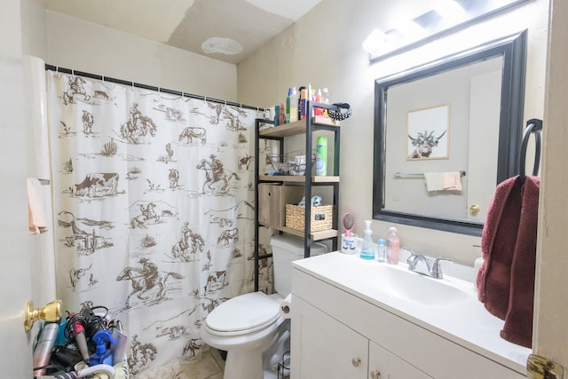 bathroom featuring tile patterned flooring, a shower with curtain, vanity, and toilet