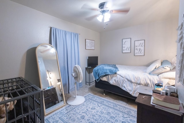 bedroom with ceiling fan and light tile patterned flooring