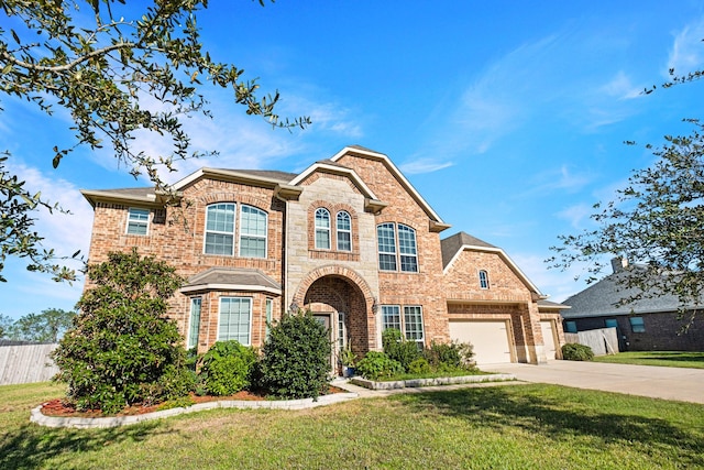 view of front of house featuring a front yard and a garage