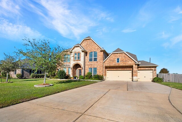 view of front facade with a front yard and a garage