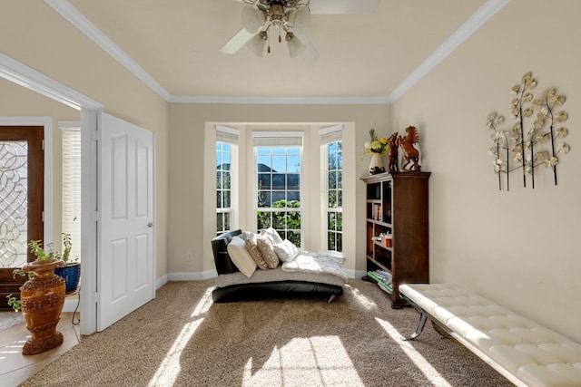 living area featuring carpet flooring, ceiling fan, and ornamental molding