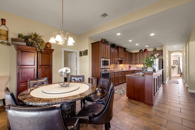 dining area featuring a chandelier