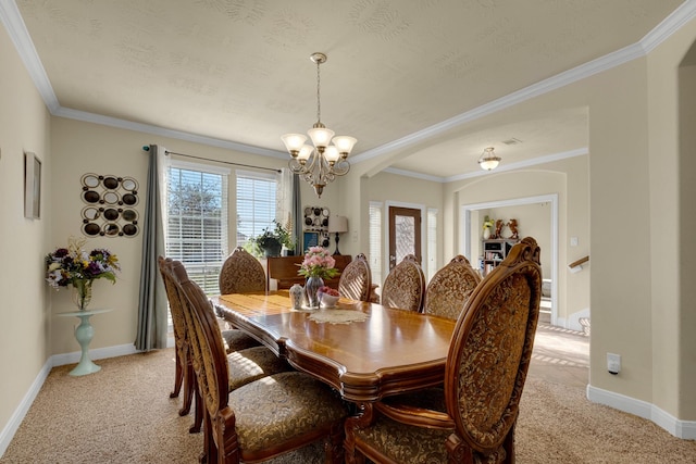 dining space featuring light carpet, crown molding, a chandelier, and a textured ceiling