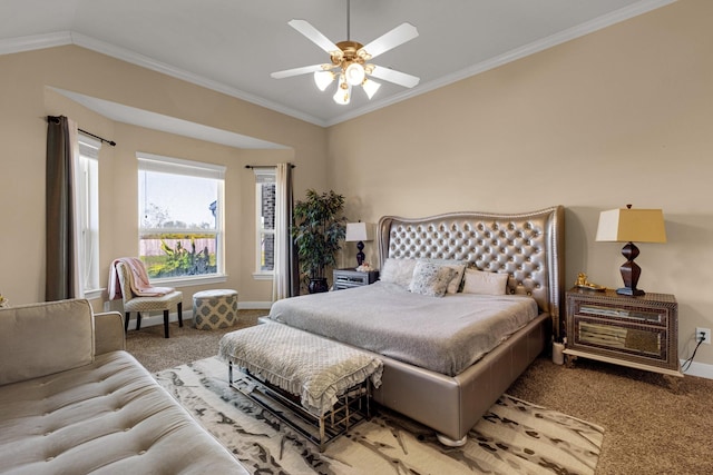 carpeted bedroom with ceiling fan, vaulted ceiling, and ornamental molding