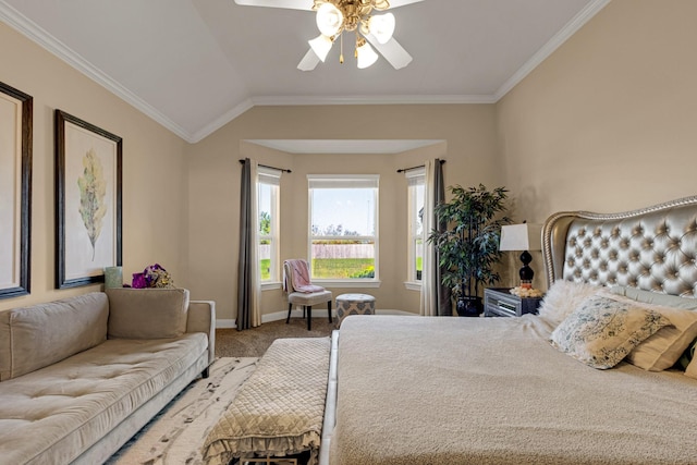 carpeted bedroom featuring ceiling fan, lofted ceiling, and ornamental molding