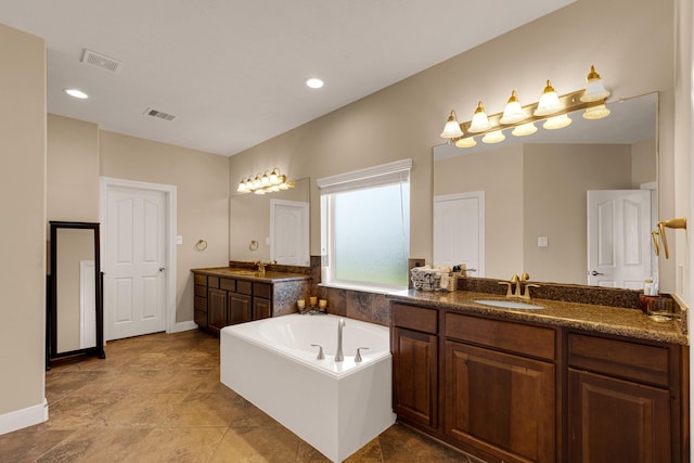 bathroom featuring vanity and a bathtub