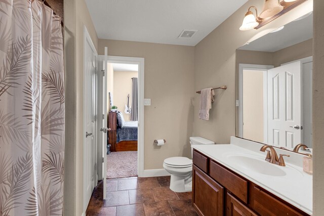 11411 Kings Point Blvd, Mont Belvieu, TX 77535 - bathroom with vanity, a shower with shower curtain, stone finish flooring, and ensuite bath