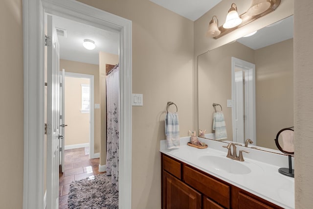 bathroom with vanity and tile patterned floors