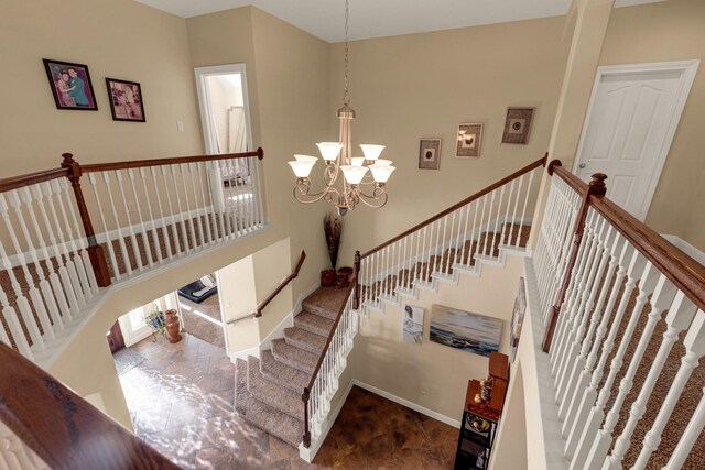 11411 Kings Point Blvd, Mont Belvieu, TX 77535 - staircase featuring a chandelier and baseboards