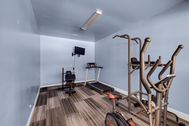 11411 Kings Point Blvd, Mont Belvieu, TX 77535 - workout area featuring baseboards